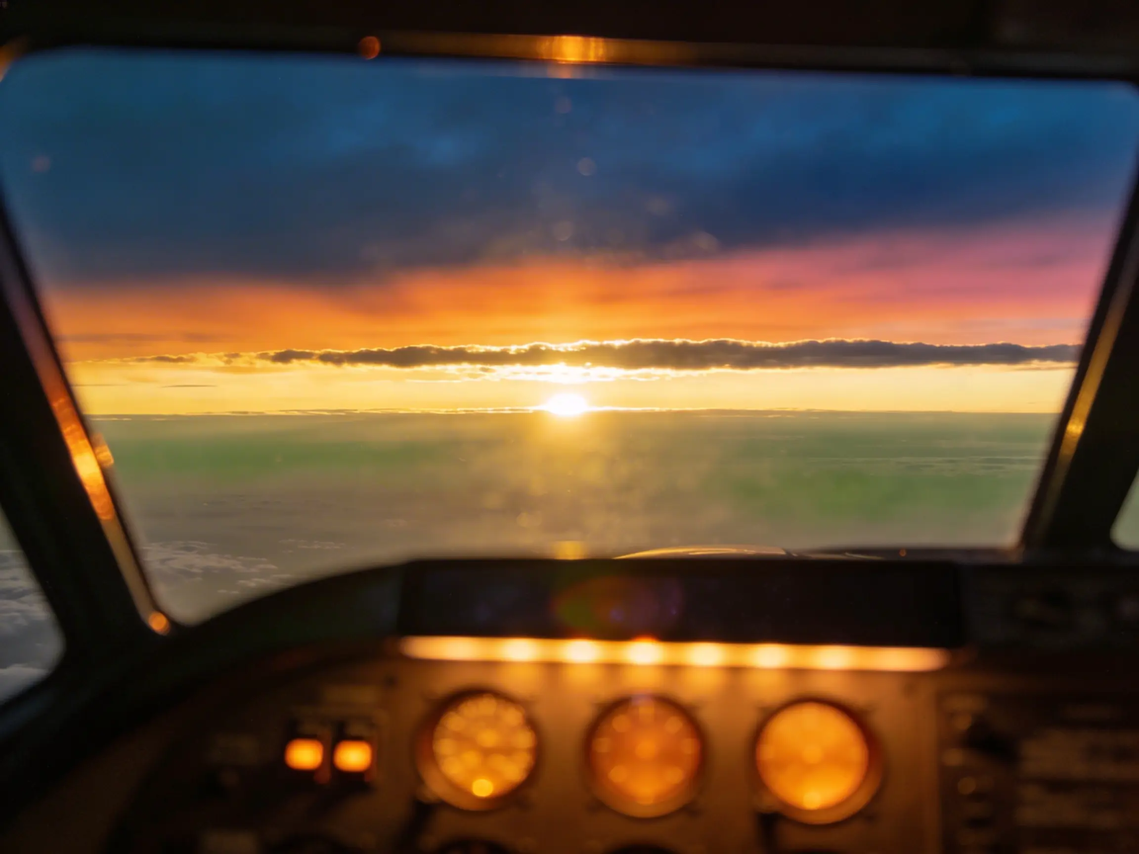 Sunset sky seen from inside a private jet cockpit